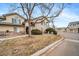Well-maintained townhome with a front lawn and assigned parking at 8621 E Dry Creek Rd # 325, Englewood, CO 80112