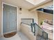 Inviting front entrance featuring a gray door and unit number 325 at 8621 E Dry Creek Rd # 325, Englewood, CO 80112