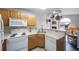 Well-appointed kitchen with a bright flow into the living area and backyard views at 8621 E Dry Creek Rd # 325, Englewood, CO 80112