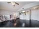Cozy living room featuring dark floors and a pass-through to the bright kitchen at 8621 E Dry Creek Rd # 325, Englewood, CO 80112