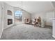 Bright living room boasts vaulted ceilings, a cozy fireplace, and a large window at 8621 E Dry Creek Rd # 325, Englewood, CO 80112