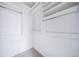 Empty walk-in closet with organizers at 8621 E Dry Creek Rd # 325, Englewood, CO 80112