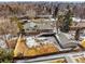 Aerial view of a fenced backyard, deck, and a detached garage in a neighborhood at 11845 W 30Th Pl, Lakewood, CO 80215