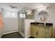 Basement bathroom with a modern sink, a vanity, and a standing shower at 11845 W 30Th Pl, Lakewood, CO 80215