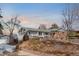 Charming ranch-style home with landscaped front yard and spacious driveway at 11845 W 30Th Pl, Lakewood, CO 80215