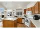 Kitchen with island and white appliances at 2586 S Independence Ct, Lakewood, CO 80227