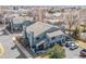 Aerial view of property showcasing well-maintained exterior, garages, landscaping, and community features at 10290 W Jewell Ave # B, Lakewood, CO 80232