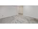 Carpeted basement area with neutral walls, ready for customization and use at 10290 W Jewell Ave # B, Lakewood, CO 80232