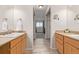 Hall bathroom with dual vanities and a neutral color palette at 10290 W Jewell Ave # B, Lakewood, CO 80232