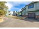 Street view of well-maintained townhomes, landscaped with ample parking spots at 10290 W Jewell Ave # B, Lakewood, CO 80232