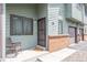 Charming townhome entrance with a cozy seating area and well-maintained landscaping at 10290 W Jewell Ave # B, Lakewood, CO 80232