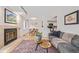 Inviting living room with a fireplace, hardwood floors, and comfortable seating, creating a cozy and stylish space at 10290 W Jewell Ave # B, Lakewood, CO 80232