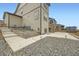 Spacious backyard with a stone patio and landscaping at 140 Racer St, Bennett, CO 80102