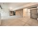 Unfinished basement with concrete floors and exposed beams at 140 Racer St, Bennett, CO 80102