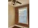 Cozy bedroom showing a brick accent wall and bright window with blinds providing natural light at 3616 N Gilpin St, Denver, CO 80205