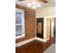 A cozy bedroom featuring exposed brick wall, dark hardwood floors, and modern ceiling fixture creating a warm atmosphere at 3616 N Gilpin St, Denver, CO 80205