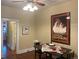 Dining room featuring hardwood floors, table with setting for two, and view to next room at 3616 N Gilpin St, Denver, CO 80205