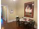 Cozy dining area with hardwood floors and a large art piece at 3616 N Gilpin St, Denver, CO 80205