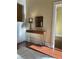 Hallway console table with modern design elements, including a hairpin-leg wooden table, a decorative lamp, and stylish mirror at 3616 N Gilpin St, Denver, CO 80205