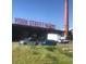 York Street Yards sign on a low brick building and red brick smokestack with cars parked in the front at 3616 N Gilpin St, Denver, CO 80205