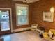 Bright living room featuring hardwood floors and a brick accent wall at 3616 N Gilpin St, Denver, CO 80205