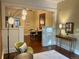 Bright living room with hardwood floors flowing into the dining area, featuring an open layout and stylish furnishings at 3616 N Gilpin St, Denver, CO 80205