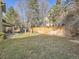 Backyard with grassy area, wooden fence, and patio at 1663 Devils Point Pl, Highlands Ranch, CO 80126