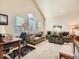 Living room with hardwood floors, large windows, and comfortable seating at 1663 Devils Point Pl, Highlands Ranch, CO 80126