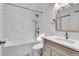 Clean bathroom with tub, shower, white subway tile and modern vanity at 13270 W 65Th Ave, Arvada, CO 80004