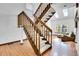Bright living area with laminate floors, stairs, a fireplace, and skylights, offering natural light and a welcoming space at 13270 W 65Th Ave, Arvada, CO 80004