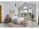 Serene main bedroom with natural light, vaulted ceiling, and ample space at 13270 W 65Th Ave, Arvada, CO 80004