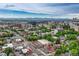 Wide aerial view showing the city and neighborhood with the Rocky Mountains in the background at 549 N Ogden St, Denver, CO 80218