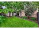 Lush backyard boasts a well-maintained lawn and patio area with outdoor seating at 549 N Ogden St, Denver, CO 80218
