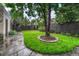 Beautiful backyard features a healthy lawn and a slate stone walkway to the side of the home at 549 N Ogden St, Denver, CO 80218