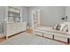bedroom featuring a twin bed with storage, dresser, hardwood floors, and area rug at 549 N Ogden St, Denver, CO 80218