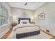 Bedroom with a comfy queen-size bed, hardwood floors, area rug, and view from window at 549 N Ogden St, Denver, CO 80218