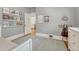 bedroom with hardwood floors, twin bed, bookshelf, and open door to hallway at 549 N Ogden St, Denver, CO 80218