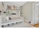 Neutral bedroom boasts a stylish decor, artwork and wall shelving for books and collectables at 549 N Ogden St, Denver, CO 80218