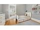 bedroom featuring a twin bed with drawers, hardwood floors, and easy access to hallway at 549 N Ogden St, Denver, CO 80218