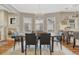 Elegant dining room featuring a modern chandelier and large windows for ample natural light at 549 N Ogden St, Denver, CO 80218