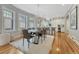 Dining area featuring hardwood floors, dining table, and open to kitchen area at 549 N Ogden St, Denver, CO 80218