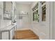 Bright entryway with hardwood floors, stylish console table, and decorative wallpaper at 549 N Ogden St, Denver, CO 80218