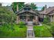 Charming craftsman home with a well-maintained lawn and inviting front porch at 549 N Ogden St, Denver, CO 80218
