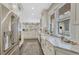 Well-lit kitchen showcasing a farmhouse sink, marble countertops, and stainless steel appliances at 549 N Ogden St, Denver, CO 80218