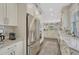 Modern kitchen featuring stainless steel appliances, marble countertops, and ample storage at 549 N Ogden St, Denver, CO 80218
