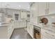 Spacious kitchen with white cabinets, stainless steel appliances, and marble countertops at 549 N Ogden St, Denver, CO 80218