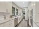Contemporary kitchen with stainless steel appliances, marble countertops, and ample natural light at 549 N Ogden St, Denver, CO 80218