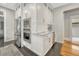 Gourmet kitchen with stainless steel appliances, marble countertops, and custom cabinetry at 549 N Ogden St, Denver, CO 80218