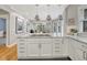 Kitchen island with marble countertops, stainless steel appliances, and modern pendant lighting at 549 N Ogden St, Denver, CO 80218
