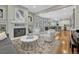 Spacious living room flows into dining area, hardwood floors, neutral palette, fireplace at 549 N Ogden St, Denver, CO 80218
